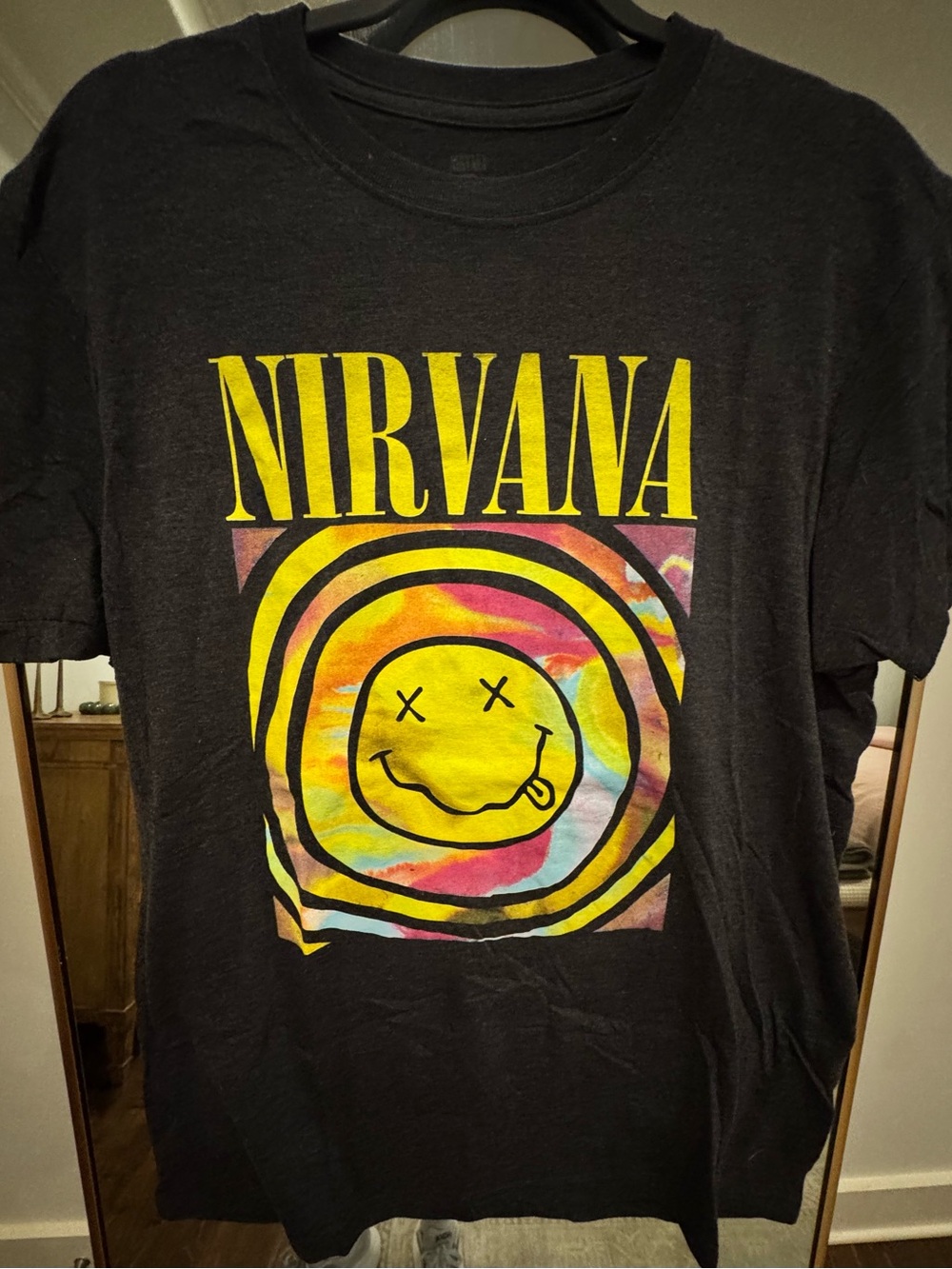 NIRVANA Black Tee with Yellow Logo and Multicolor Tie-Dye Smiley